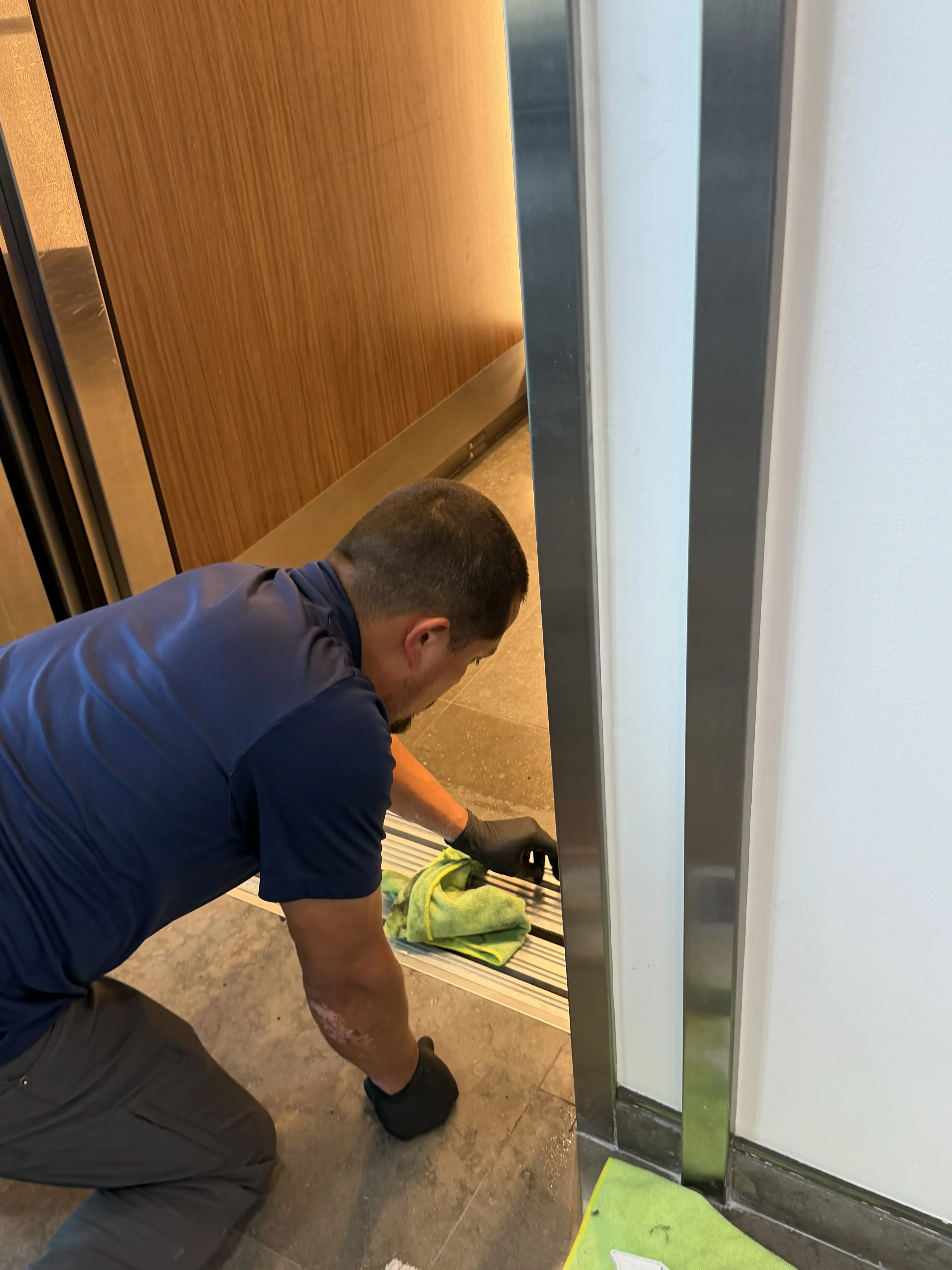 Day porter cleaning commercial lobby in Orange County